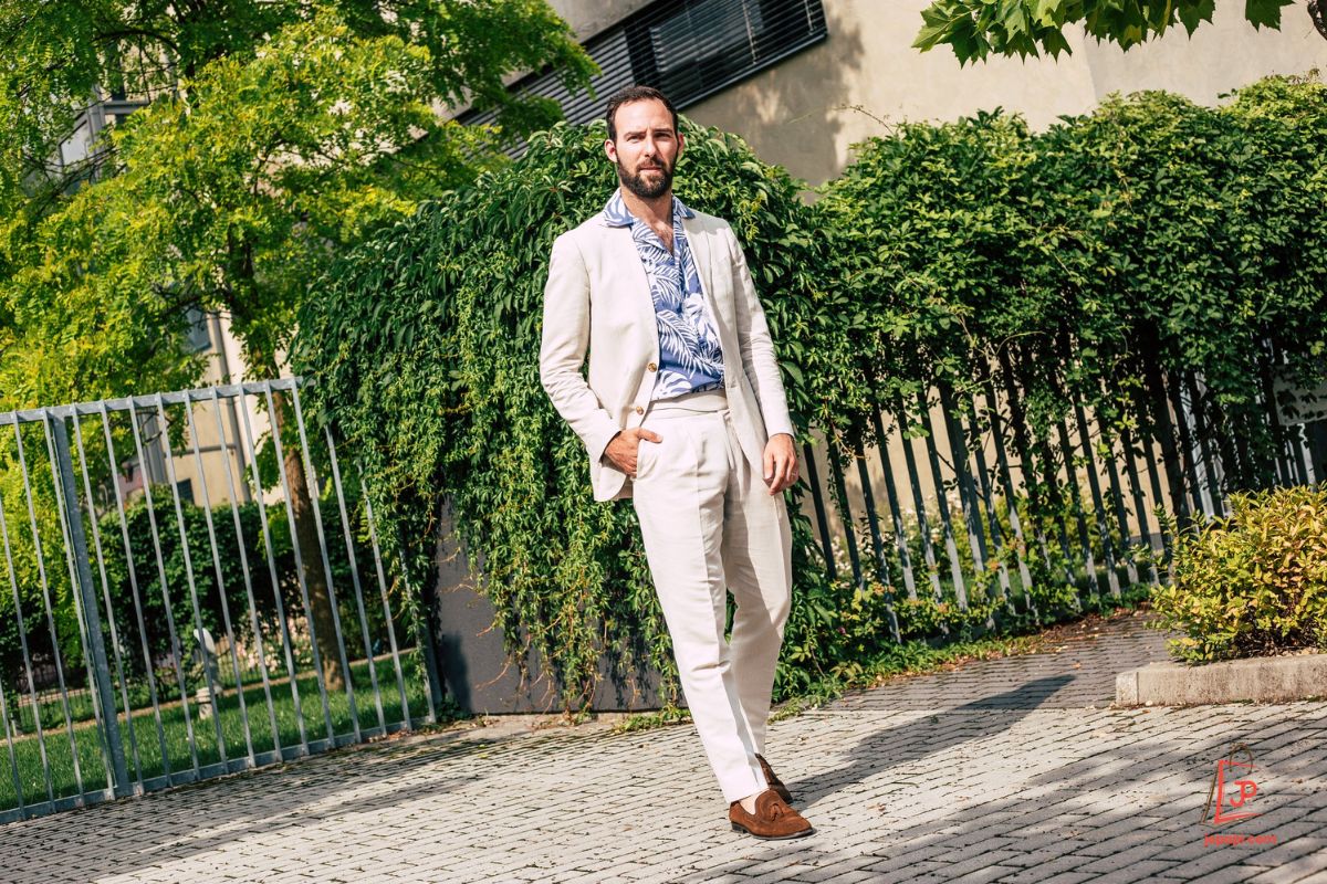 Dress up your Hawaiian shirt with chinos and a light blazer for a polished, smart-casual outfit that works for any summer event.